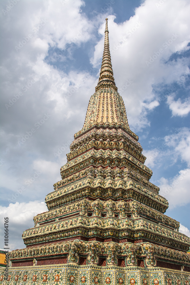 Fototapeta premium Pagoda is in Wat Pho that was named as the temple of the pagoda or chedi that are decorated with yellow glaze or glazed tiles or dark blue. 