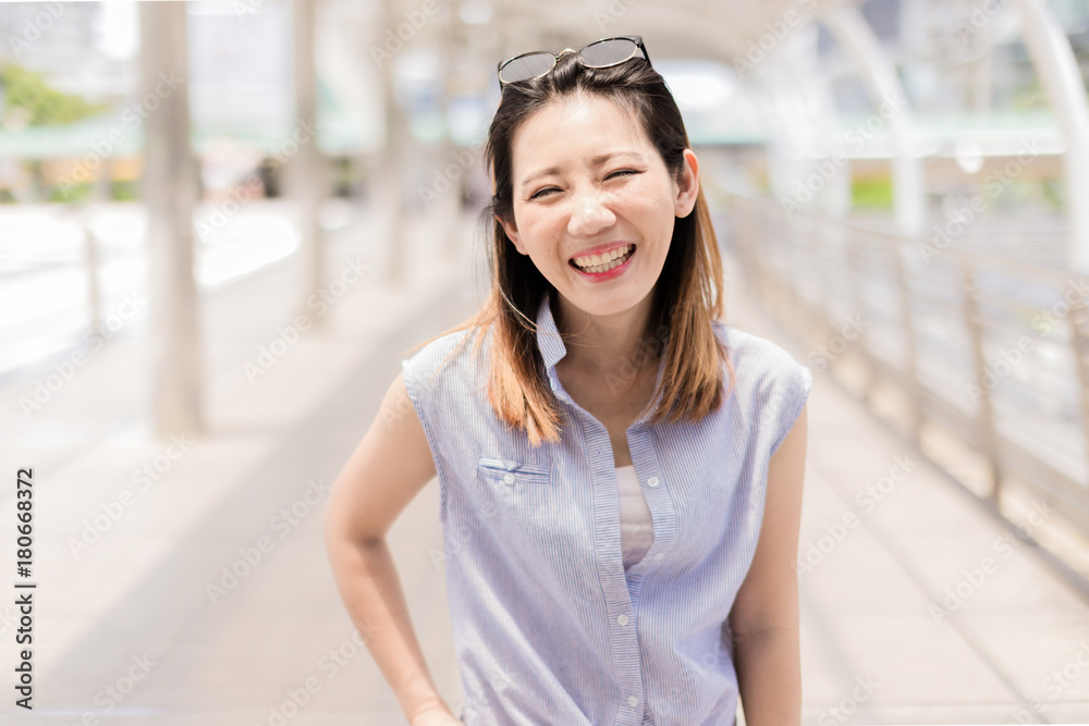 beautiful happiness young asian girl in casual dress traveling alone at train station or airport with backpack vintage tone photo concept