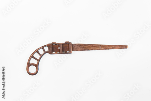 Antique miniature metal saw on a white background - center photo