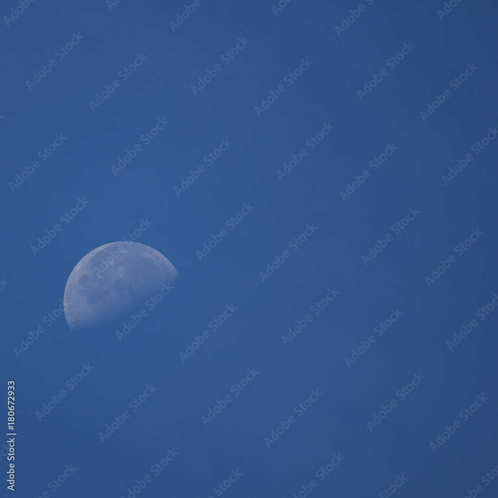 The Moon in the Morning time with blue sky background The Moon in the Morning time with blue sky background