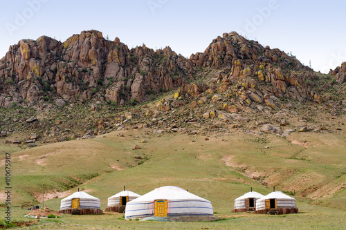 Mongolian jurts at mountain foot photo
