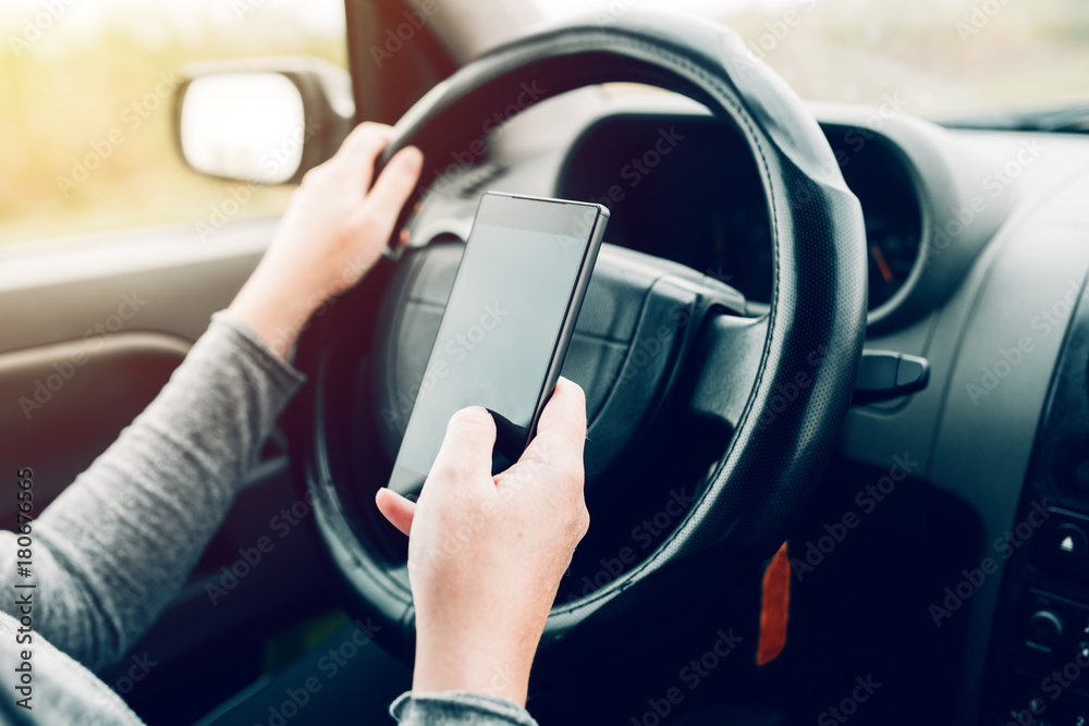 Woman using car navigation on smartphone