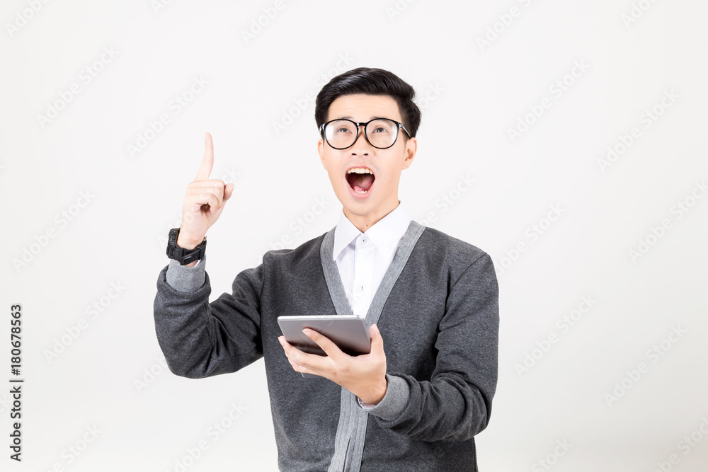 Portrait of a young man holding reading the tablet. Studio shot on white background. Concept for Education or business Portrait of a young man holding reading the tablet. Studio shot on white background. Concept for Education or business