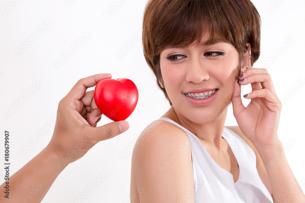 Beautiful young asia woman with red heart. Isolated on white background. Studio lighting. Concept for healthy. Beautiful young asia woman with red heart. Isolated on white background. Studio lighting. Concept for healthy.