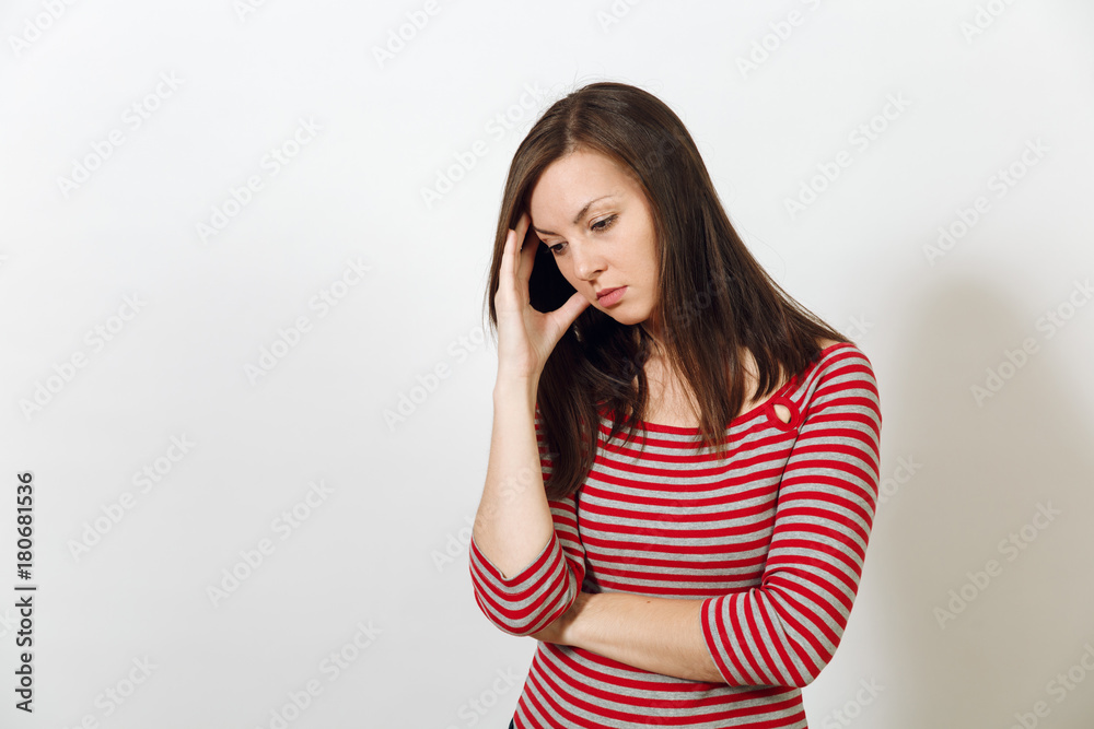 Pretty European young worried and pensive brown-haired woman with healthy clean skin, dressed in casual red and grey clothes lost in thought and conjectures, on a white background. Emotions concept. Pretty European young worried and pensive brown-haired woman with healthy clean skin, dressed in casual red and grey clothes lost in thought and conjectures, on a white background. Emotions concept.