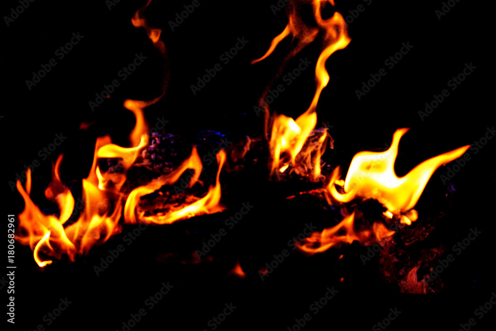 Fire flames on dark background Fire flames on dark background