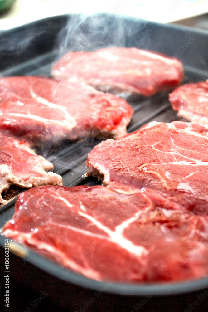 meat fried in a grill pan meat fried in a grill pan