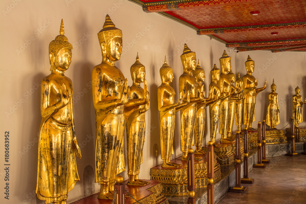 Fototapeta premium Standing Buddha image at Wat Pho that is a Buddhist temple complex Chinese and Thai style in Bangkok, Thailand