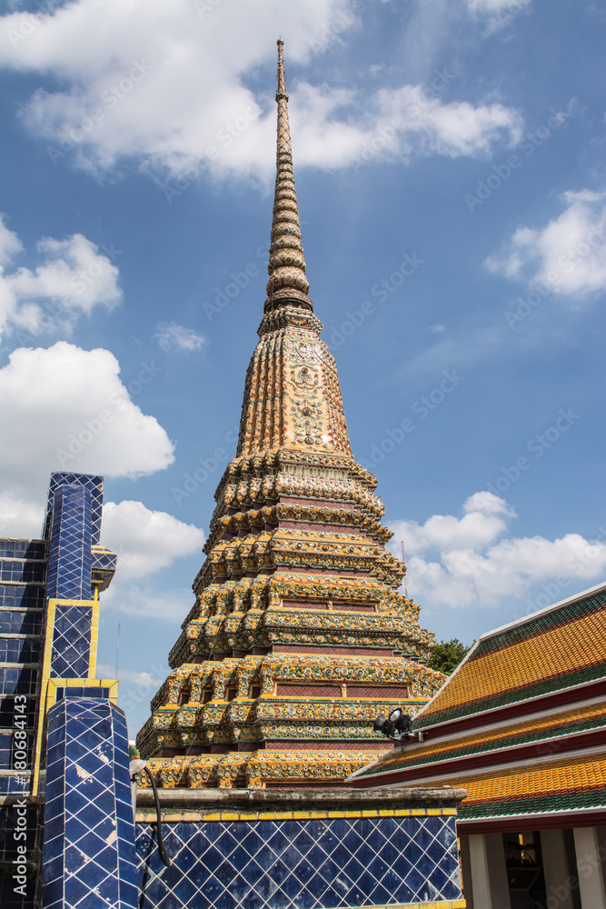 Fototapeta premium Pagoda is in Wat Pho that was named as the temple of the pagoda or chedi that are decorated with yellow glaze or glazed tiles or dark blue