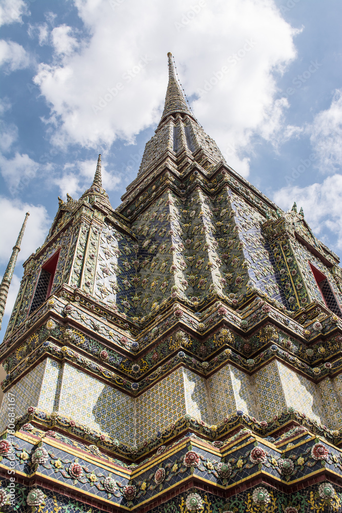 Fototapeta premium Pagoda is in Wat Pho that was named as the temple of the pagoda or chedi that are decorated with yellow glaze or glazed tiles or dark blue