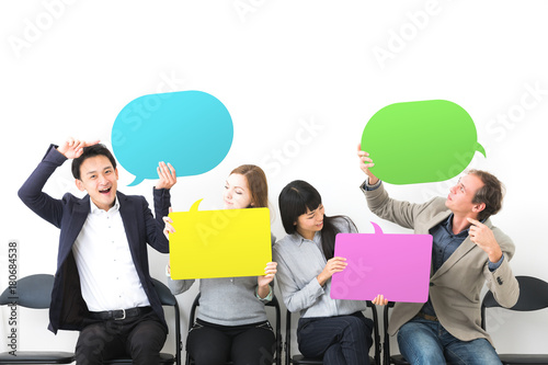 Group of people showing message boards. photo