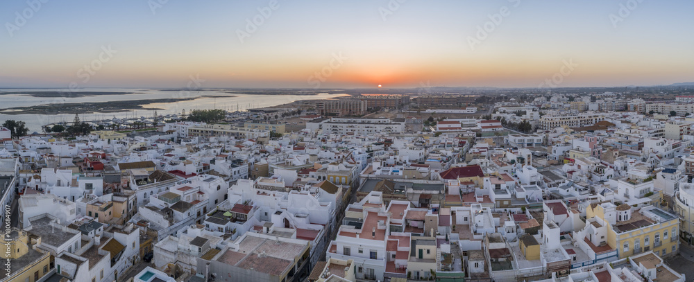 Sunset aerial cityscape in Olhao, Algarve fishing village view of ancient neighbourhood of Barreta, and its traditional cubist architecture.