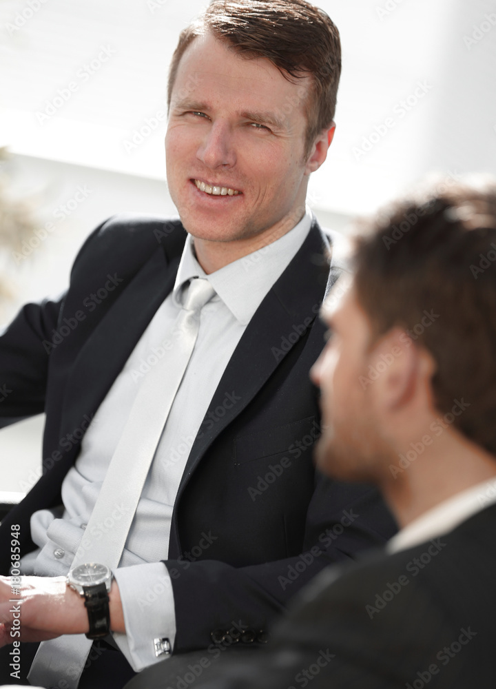 Fototapeta premium successful businessman with his colleague sitting behind a Desk.