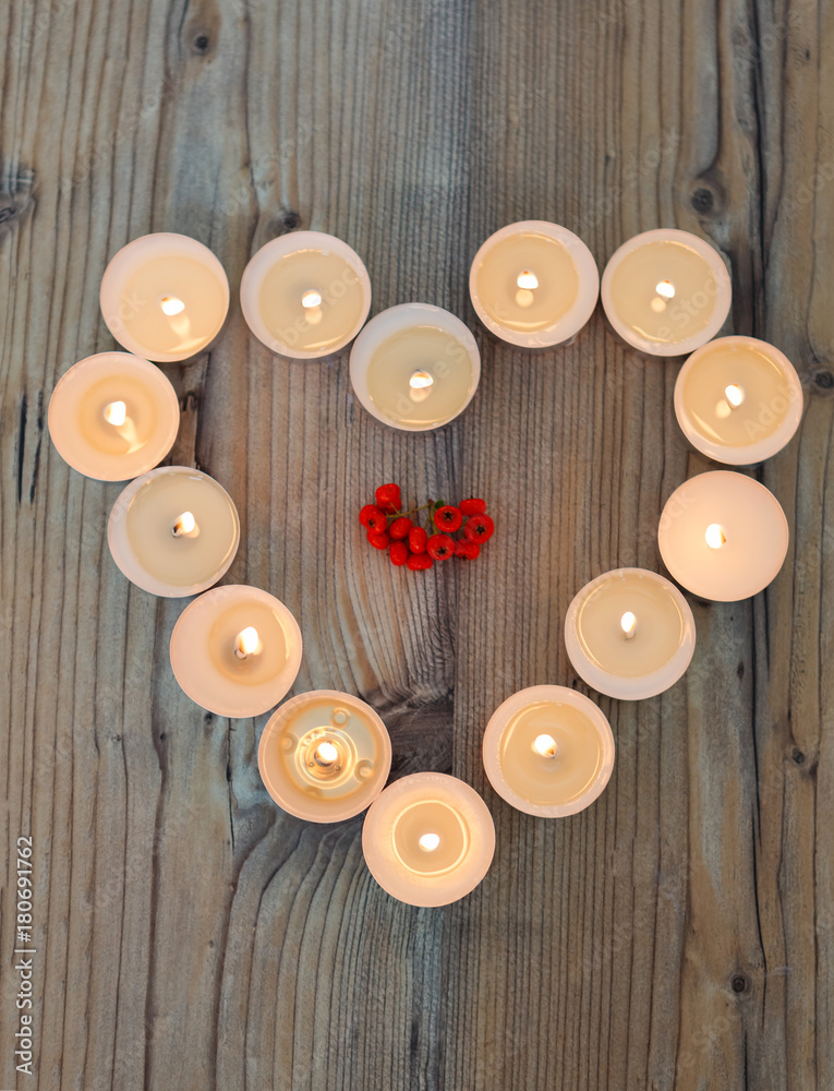 Heart shape made from burning candles Heart shape made from burning candles