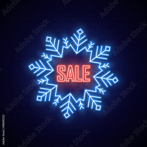 Neon signboard in shape snowflake. Bright neon banner of sale.