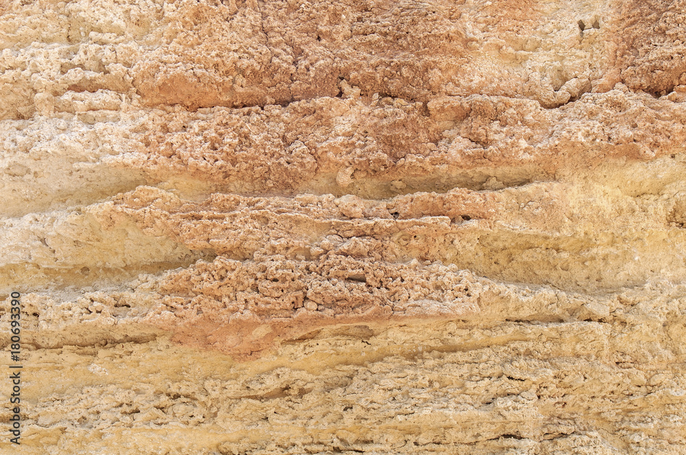 Obraz premium Red and yellow rocky mountain cliff natural texture wall background