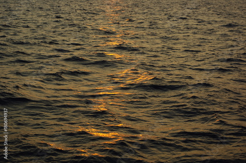 sunset over the sea waves