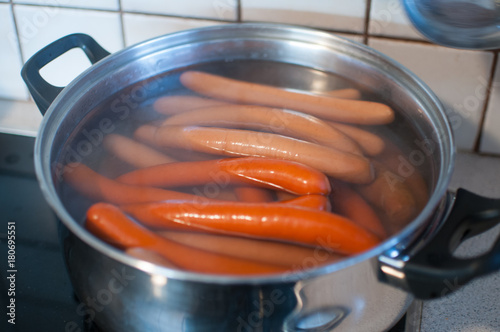 фотографія sausages in pot with water