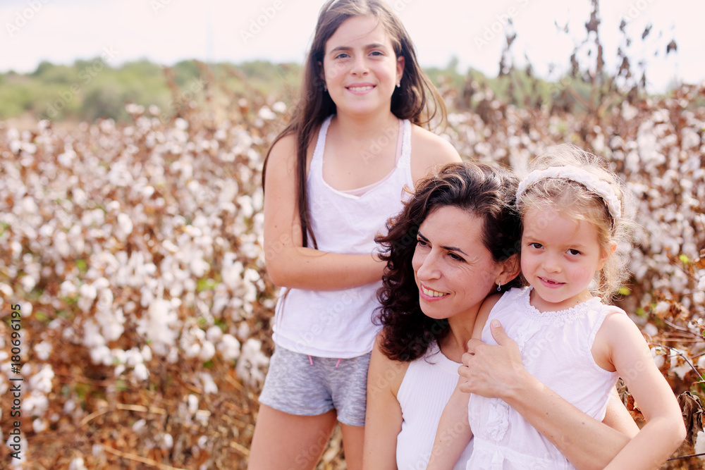 Portrait of beautiful mother with two daughters outdoors Portrait of beautiful mother with two daughters outdoors