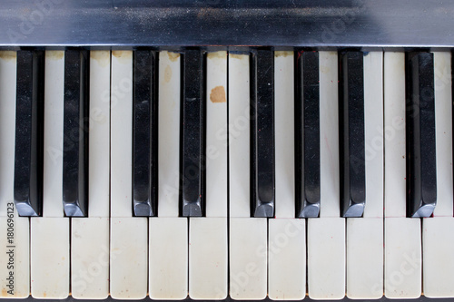 an old broken and damaged piano