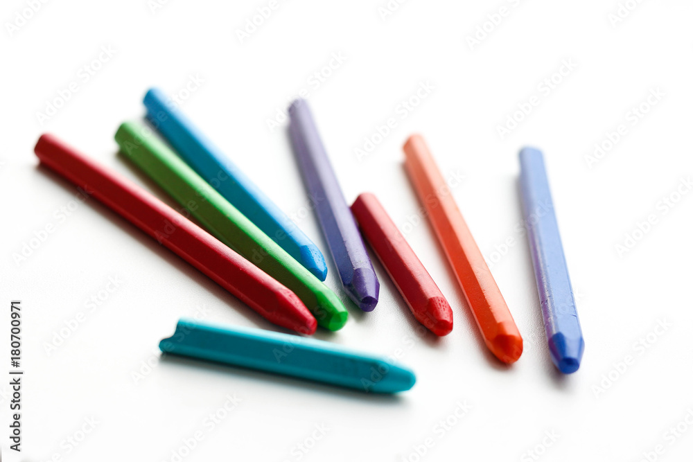 Colored wax crayons. Isolated on a white background. Closeup Colored wax crayons. Isolated on a white background. Closeup