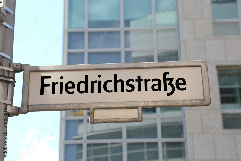 main street of Berlin in the road sign called friedrichstrasse t