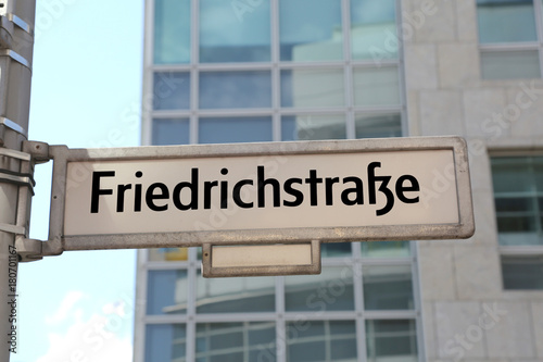 main street of Berlin in the road sign called friedrichstrasse t