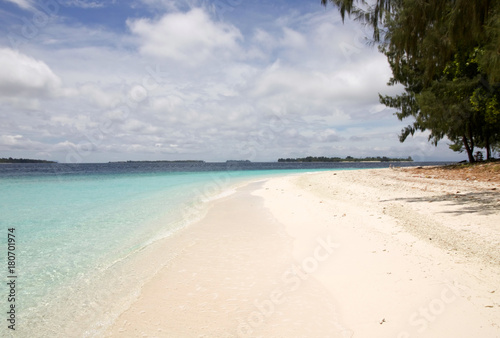 Fototapeta Naklejka Na Ścianę i Meble -  beautiful  tropical beach with pristine water in raja ampat archipelago
