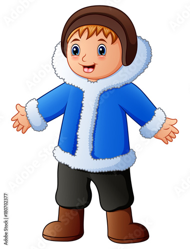 Happy boy in blue winter clothes