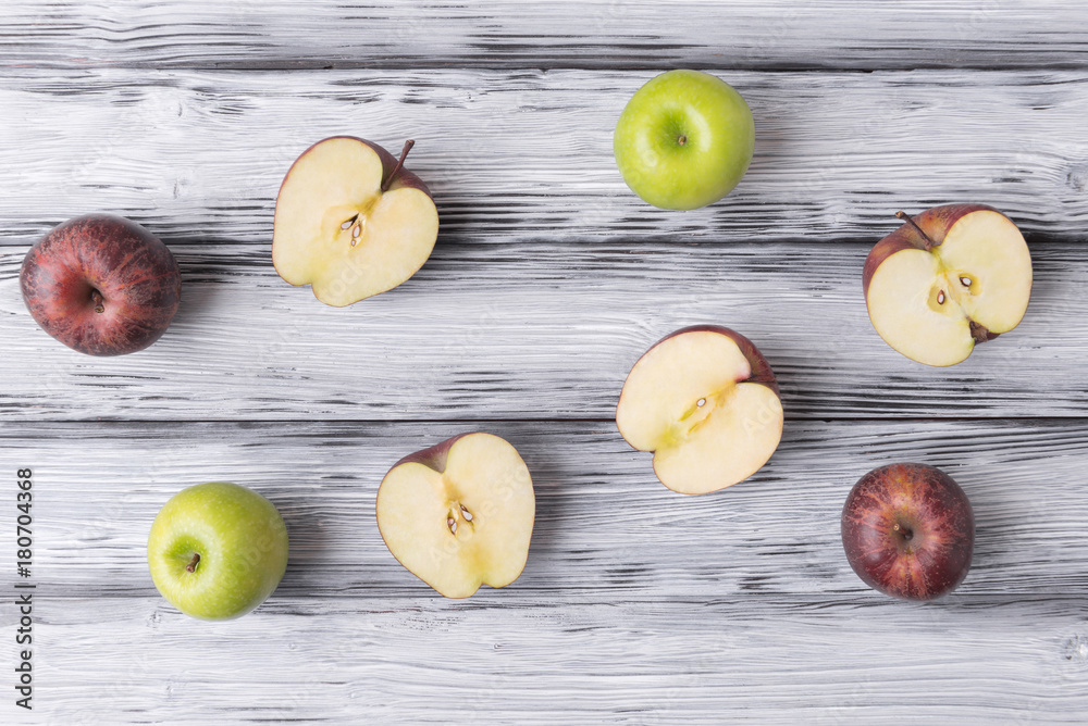 Sliced apples on white wooden background Sliced apples on white wooden background