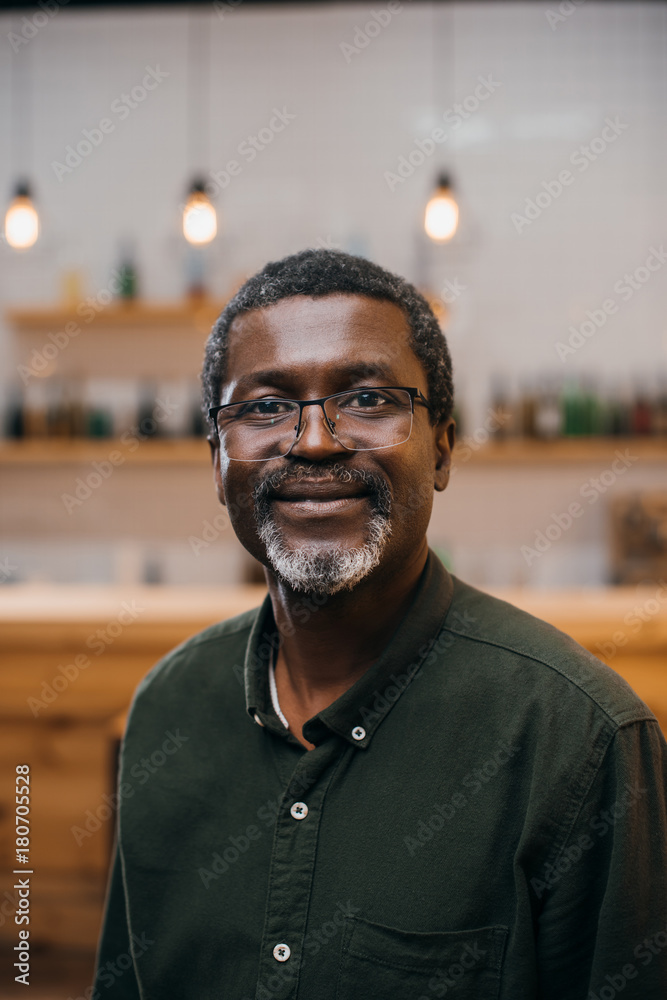 © LIGHTFIELD STUDIOS - mature man in bar