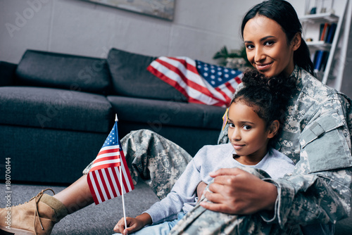 daughter and mother with american flag