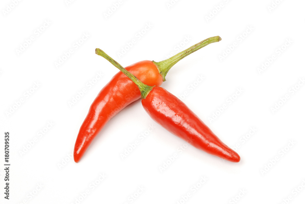 Many red peppers on white background    