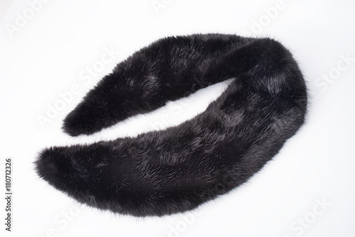 Black fur collar isolated on white background