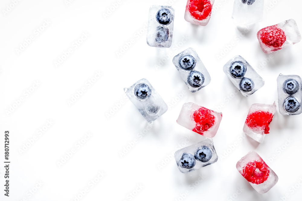 Frozen berry in ice cubes on white background top view mock-up Frozen berry in ice cubes on white background top view mock-up
