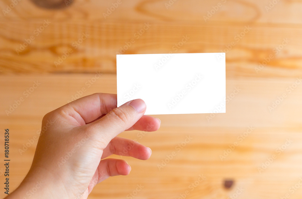 Obraz premium Business card on a wooden background