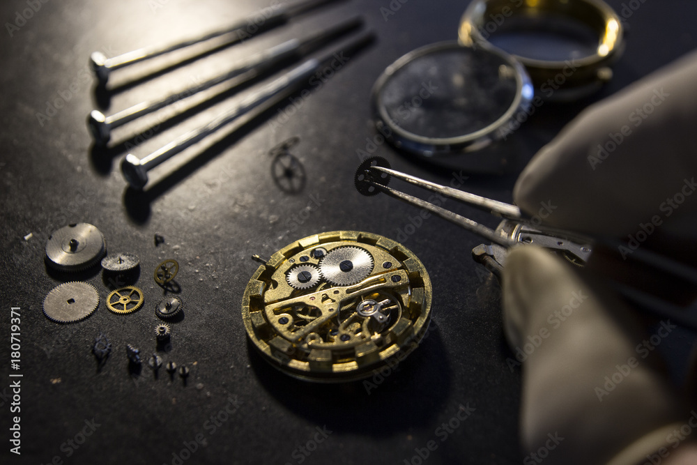 Watchmaker is repairing the mechanical watches in his workshop