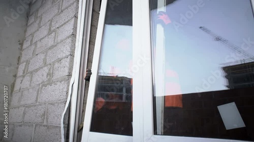 Workers put the plastic door in the opening