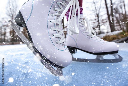 Close-up of woman ice skating on a pond. photo