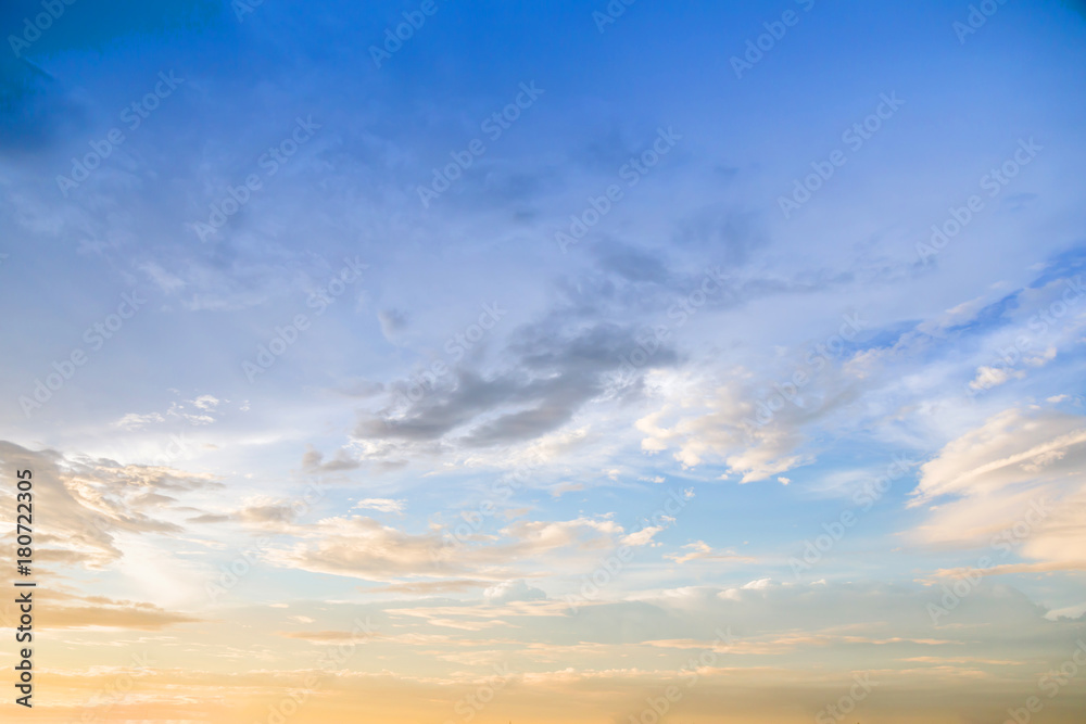 Dramatic sunset and sunrise sky with beautiful and colorful nice soft cloud background concept.