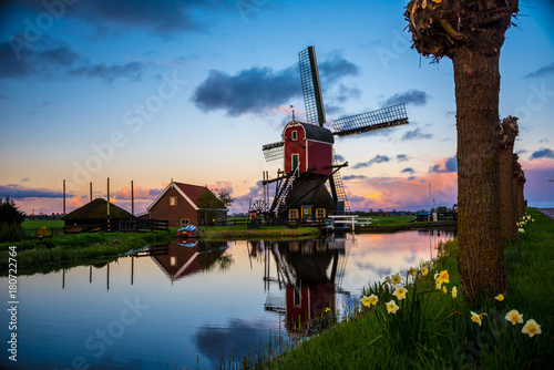 Dutch windmill at sunrise