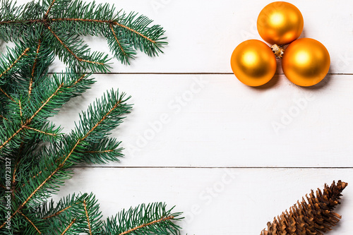 Christmas composition. pine cones, fir branches on wooden white background. Flat lay, top view photo