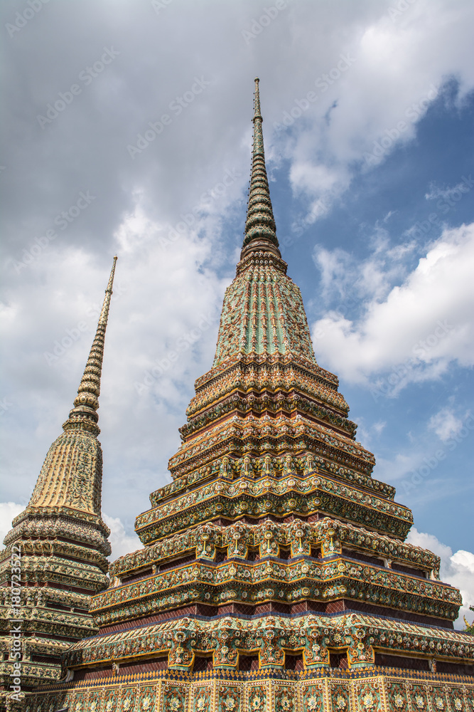 Fototapeta premium Pagoda is in Wat Pho that was named as the temple of the pagoda or chedi that are decorated with yellow glaze or glazed tiles or dark blue. 
