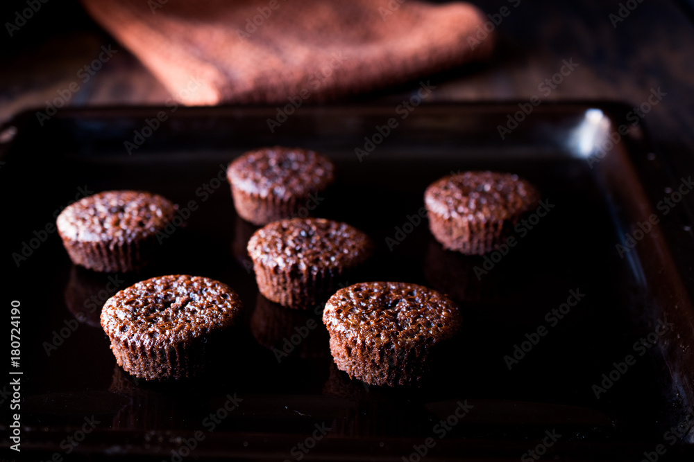 Mini Chocolate Cake Souffle on wooden surface. Mini Chocolate Cake Souffle on wooden surface.