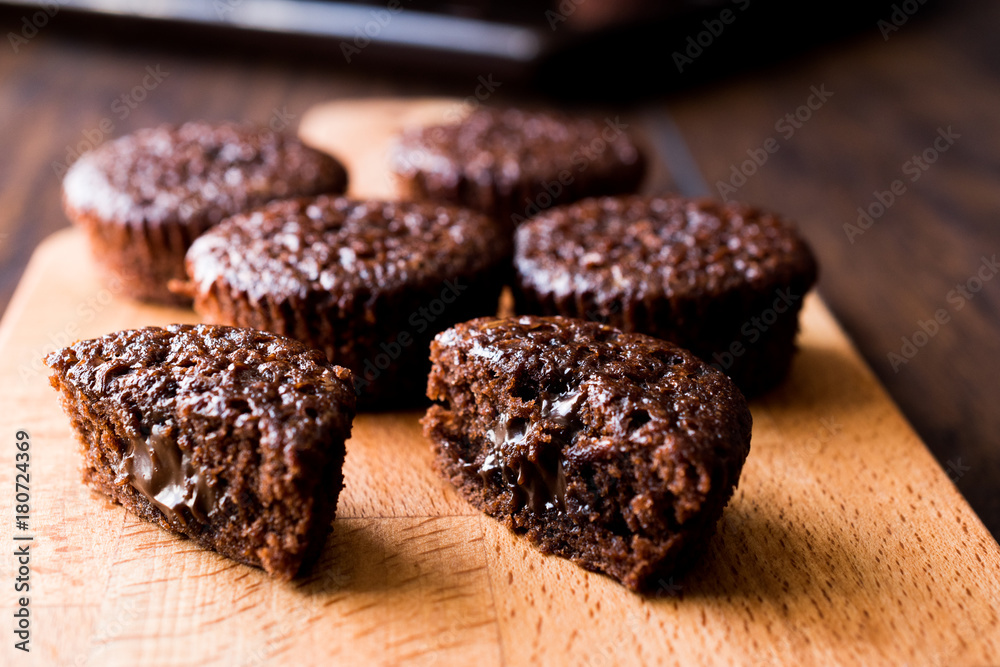 Mini Chocolate Cake Souffle on wooden surface. Mini Chocolate Cake Souffle on wooden surface.