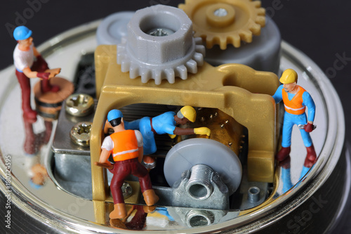 Selective focus of miniature engineer and worker fixed and repair musical box, use for product background.