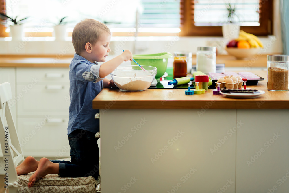 Adorable child making cookies