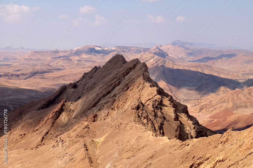 Fototapeta premium Sharp ridge in mountain range of Crater Ramon, Negev desert in Israel.