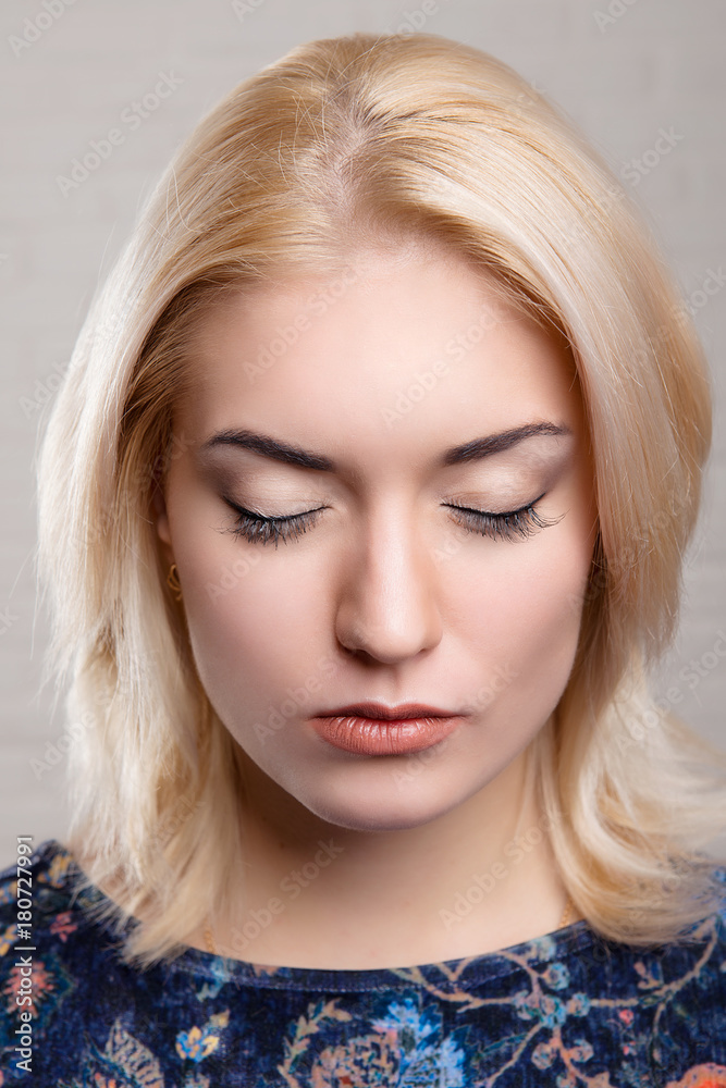 Everyday makeup closeup on closed eyes girl blonde face front. Everyday makeup closeup on closed eyes girl blonde face front.