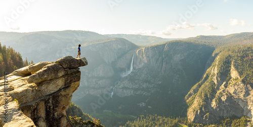 Hiker at the Glacier Point with View to Yosemite Falls and Valley in the Yosemite National Park, California, USA